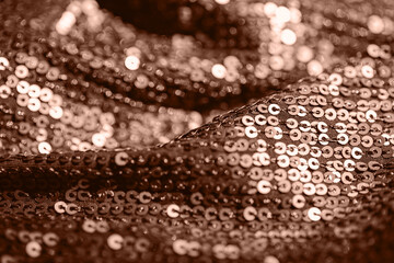 Abstract composition of fabric with shiny sequins. Holiday and party concept. Color of the year 2025 inspired