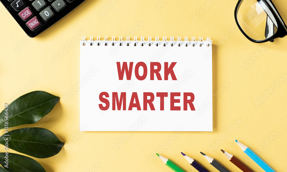 Poster work smarter text written on a notebook with pencils and graphs.
