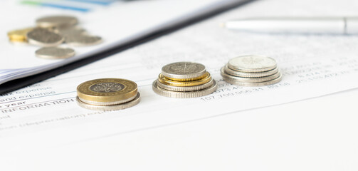 Close up of coins to stack of coins, Business Growth concept, There is money coins to stack of coins. Financial risk.