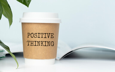 Positive thinking concept with hot coffee cup on nature background