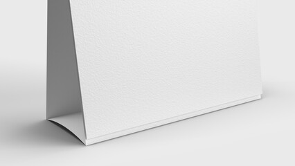 white paper desk calendar on white background for mockup