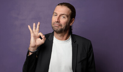 feeling happy, relaxed and satisfied, showing approval with okay gesture, smiling