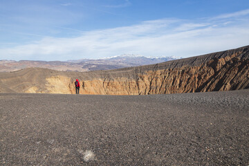 Hiker on the crater rim trail at Death Valley National Park, California