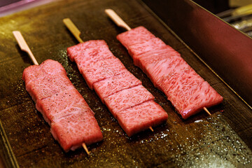 Raw Japanese Kobe beef cuts ready for grilling.
