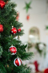 Merry x-mas,Close up of Colorful balls ,gifts box and Christmas greeting picture parcel,bell decoration on Green Christmas tree background Decoration During Christmas and New Year.