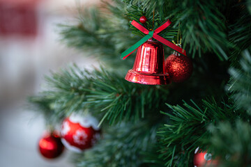 Merry x-mas,Close up of Colorful balls ,gifts box and Christmas greeting picture parcel,bell decoration on Green Christmas tree background Decoration During Christmas and New Year.