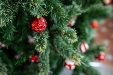 Merry x-mas,Close up of Colorful balls ,gifts box and Christmas greeting picture parcel,bell decoration on Green Christmas tree background Decoration During Christmas and New Year.