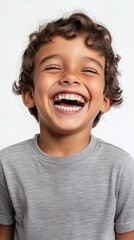 Joyful Child Portrait: A close-up shot of a happy child with curly hair, radiating pure, infectious joy. His bright smile and sparkling eyes capture the essence of childhood innocence and happiness. 