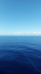 Fototapeta premium Tranquil Horizon: An expansive vista of the cerulean ocean meets the azure sky, creating a serene and meditative backdrop. The tranquil waters whisper tales of adventure and exploration.