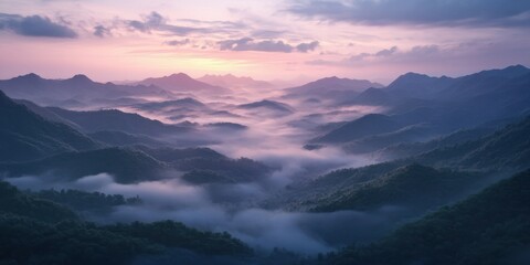 Fototapeta premium Dawn mountain landscape with misty clouds