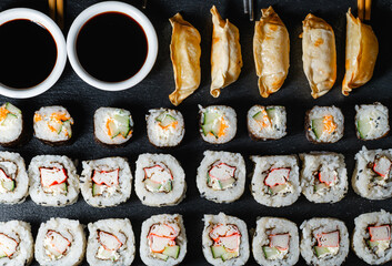 Photo of sushi rolls of different size and flavor
