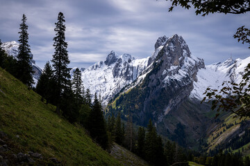 alpine landscape of the alps in switzerland with snow and peaks in autumn