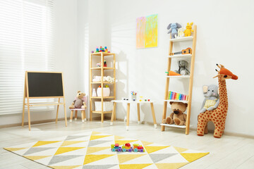 Beautiful child's room interior with toys and stylish furniture