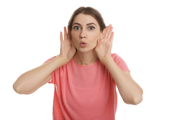 Woman showing hand to ear gesture on white background