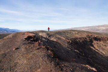 Hiker on the crater rim trail at Death Valley National Park, California