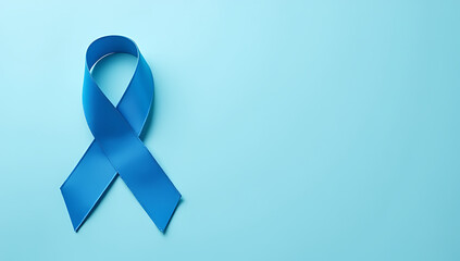 A photo of a blue ribbon and mustache shape symbol for prostate cancer awareness set against an isolated pastel blue background with empty space._00001_