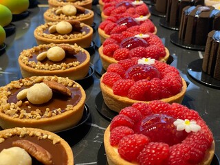 small gourmet desserts made of chocolate and raspberries 