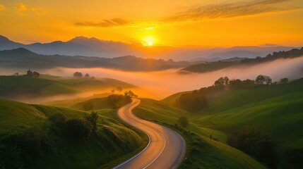 Winding road through lush landscape at sunrise