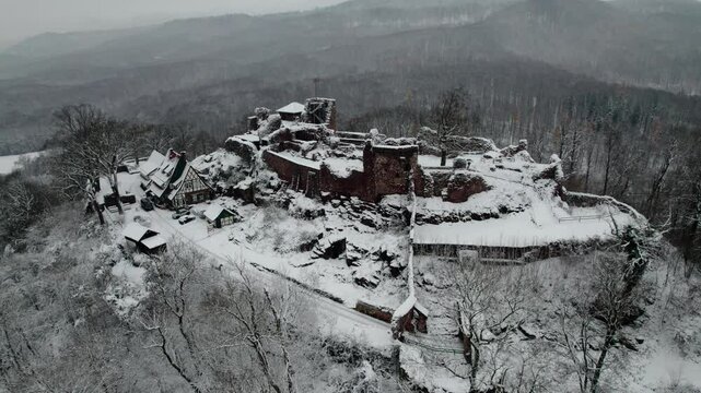 Aerial view ruins of old castle. Winter. Ruin of Hohnstein Castle, Harz mountains, Germany.