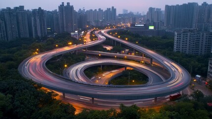 Night cityscape with illuminated highway overpass and traffic trails.