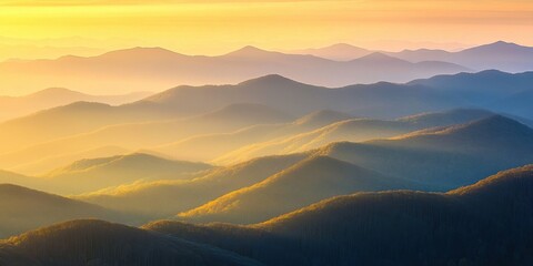 Golden sunrise over serene mountain ridges