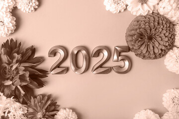 Numbers and dahlia flowers. 2025 new year idea concept. Demonstrating the colors of 2025 - Mocha...