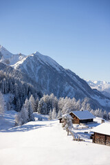 
Winter in mountains. An amazing winter scenery with a snow covered traditional alpine hut. 