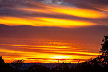 Obraz premium Sunrise with intense natural orange lights and idyllic dramatic scenery