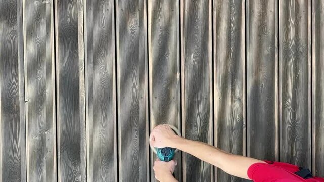 Wood deck renovation sanding a deck with orbital power sander