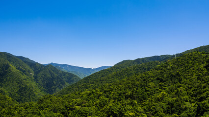 Naklejka premium Green mountain with sky clouds natural landscape at sunny weather.