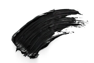 Black mascara brush stroke on white background  cosmetic product swatch.
