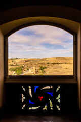 Segovia, Spain, landscape of city outskirts with Church of La Vera Cruz seen from the window with...