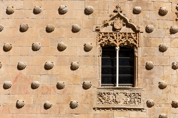 Casa de las Conchas in Salamanca, Spain, facade decorated with shell carvings, gothic style, window...