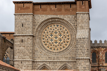 Gothic Cathedral of Avila tower with decorative rose window (rosette), Avila, Spain.