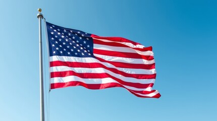 Obraz premium A close-up of the USA flag waving gracefully in the wind, showcasing its vibrant red, white, and blue