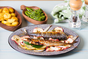 Grilled mackerel fish with roasted potatoes and broccoli