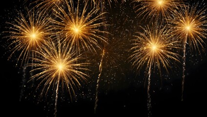 Naklejka premium Golden fireworks explode against a dark night sky.