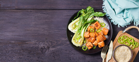 Salmon teriyaki with pak choi and rice. View from above, top studio shot with copy space
