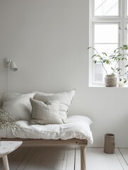 Minimalist corner with a comfy white daybed and tranquil window view, embodying simplicity.