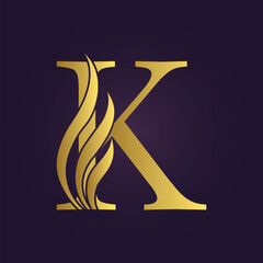 Elegant Gold Letter 'K' with Decorative Flourishes on Purple Background