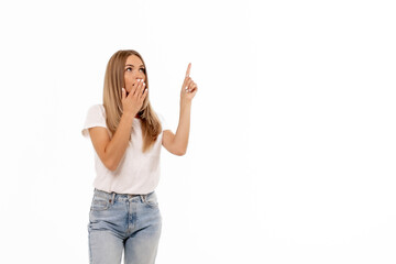 A surprised woman gestures upward with one finger while looking astonished against a white...