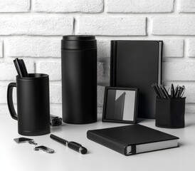 Promotional items like a thermos mug, a regular mug, assorted gifts, pens in packages, notebooks, tools, a cap, and a flag arranged on a table set against a grey wall with some open space.