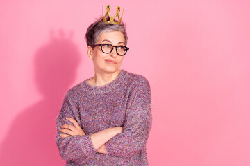 Photo of dountful unsure woman wear sweater crossed arms folded looking empty space isolated pink...
