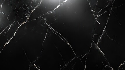 Elegant black marble surface with white veining, perfect for interior design.