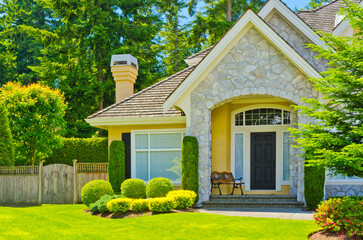Entrance of grey painted luxury house in summer with stair steps and nice landscape in Vancouver,...