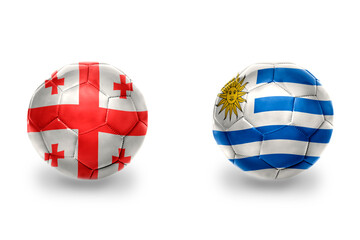Obraz premium football balls with national flags of georgia and uruguay ,soccer teams. on the white background.