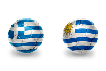 football balls with national flags of greece and uruguay ,soccer teams. on the white background.