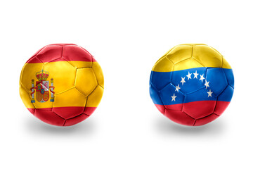 football balls with national flags of spain and venezuela ,soccer teams. on the white background.