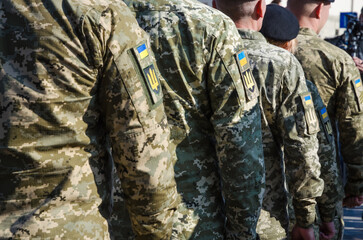 Ukrainian soldiers on military parade. Ukrainian flag on military uniform. Ukraine troops.