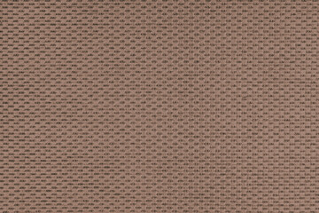 Plain brown jacquard upholstery fabric, satin material with woven structure, pattern texture background. Close up, macro cloth textile surface. Wallpaper, backdrop with copy space